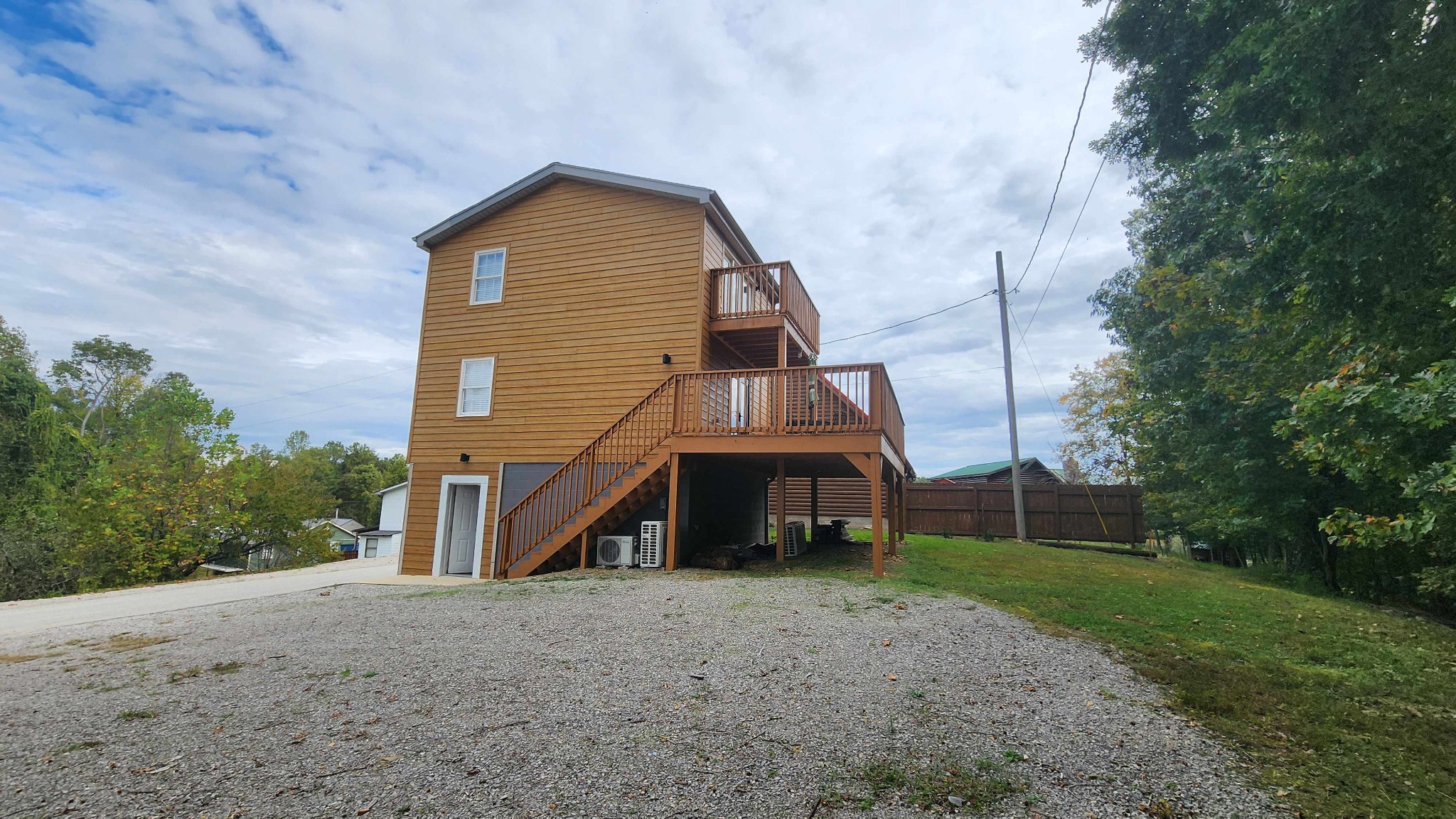 281 Bill Hunter Road Celina, TN 38551 - Photo 42 of 55 a view of a house with a yard and large tree