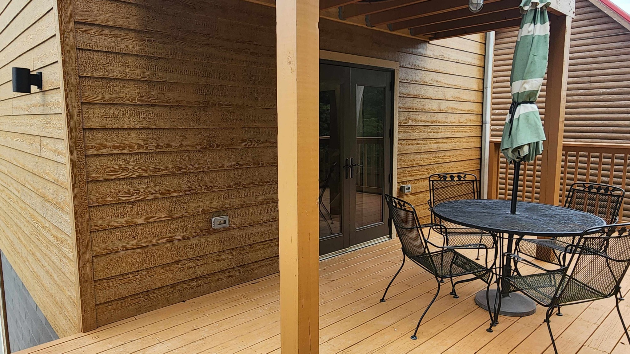 281 Bill Hunter Road Celina, TN 38551 - Photo 44 of 55 a view of a patio with table and chairs with wooden floor and plants