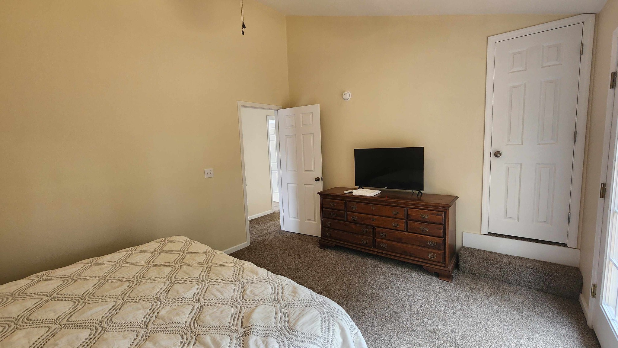 281 Bill Hunter Road Celina, TN 38551 - Photo 5 of 55 a bedroom with a bed and flat screen tv