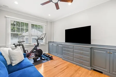 a bed room with furniture and a flat screen tv