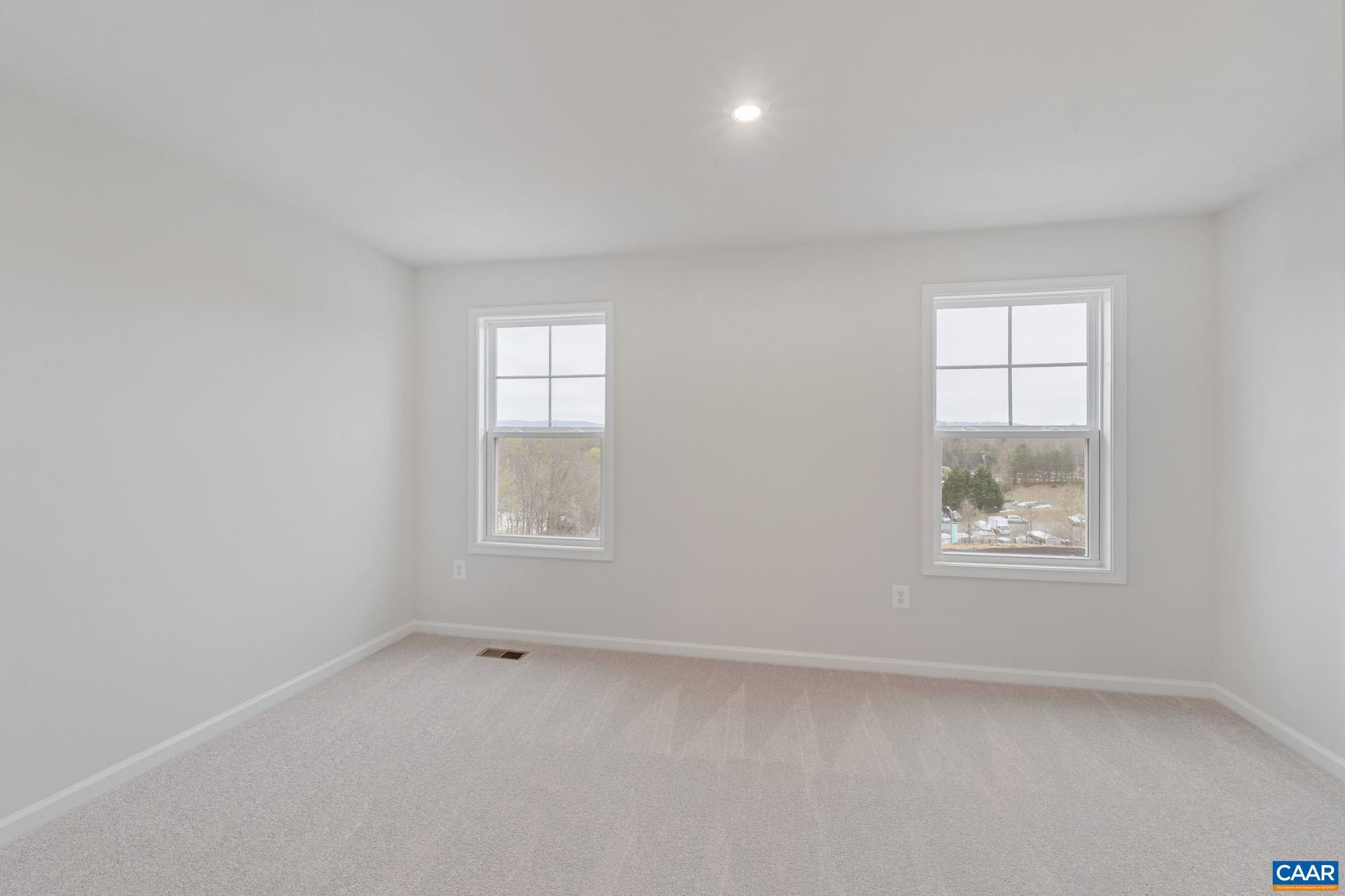2249 Woodburn Road Charlottesville, VA 22901 - Photo 13 of 34 an empty room with windows