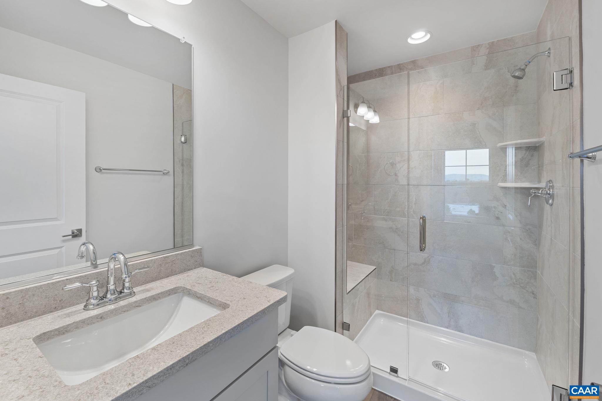 2249 Woodburn Road Charlottesville, VA 22901 - Photo 16 of 34 a bathroom with a sink a toilet and shower