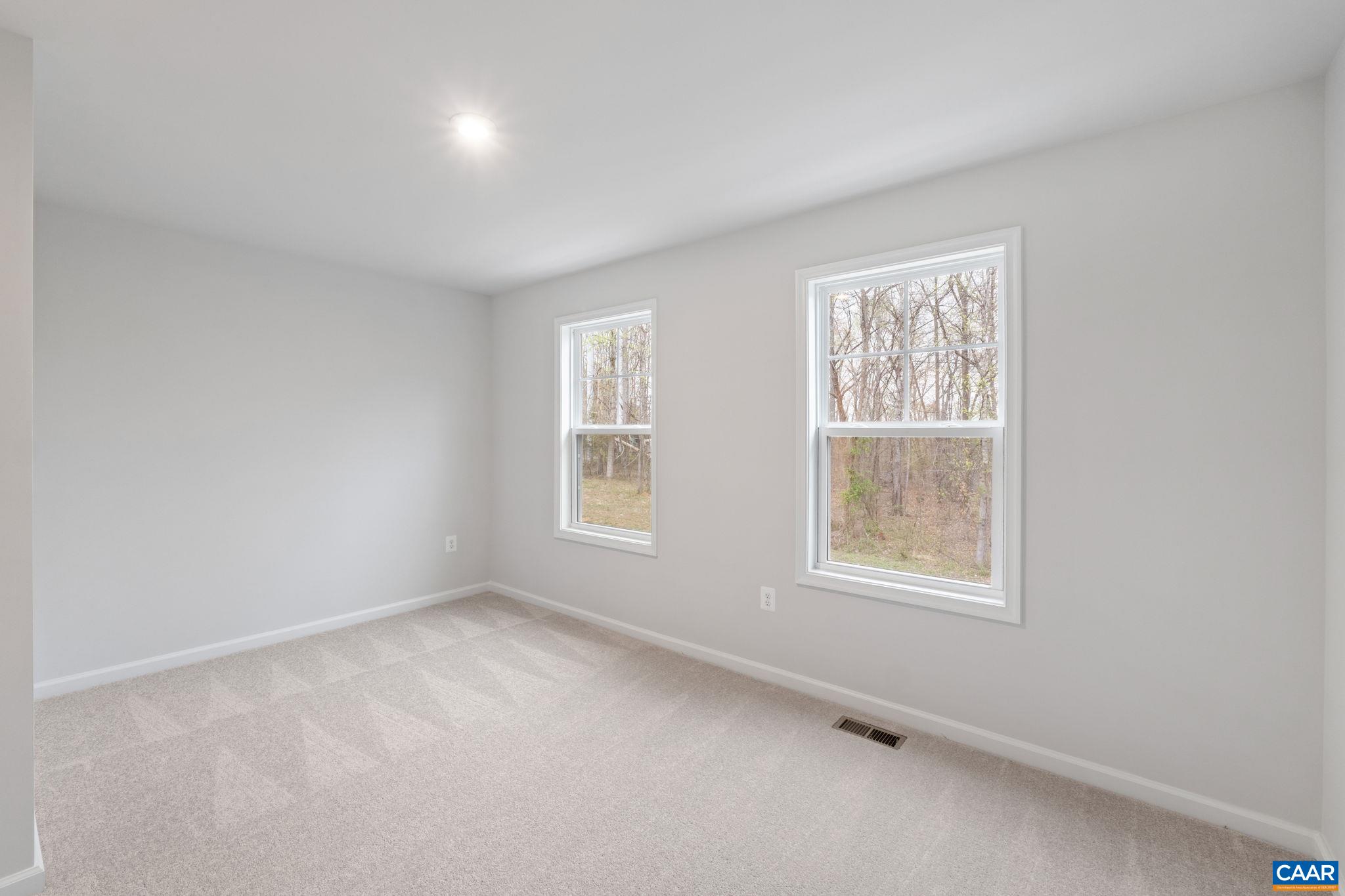 2249 Woodburn Road Charlottesville, VA 22901 - Photo 18 of 34 an empty room with windows