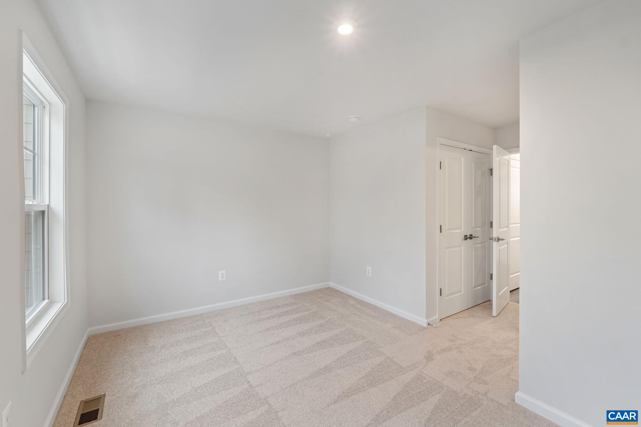 2249 Woodburn Road Charlottesville, VA 22901 - Photo 19 of 34 an empty room with a window