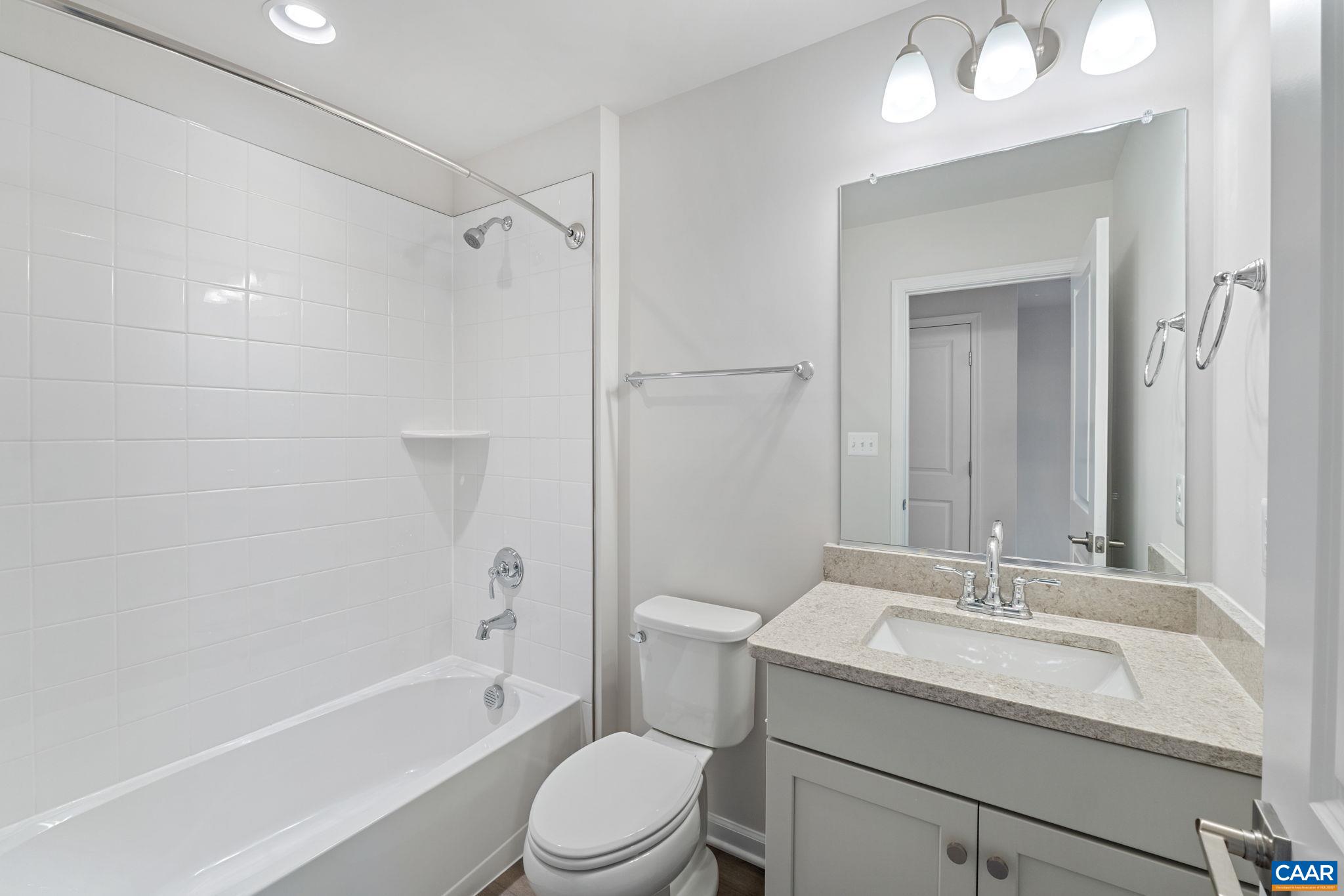 2249 Woodburn Road Charlottesville, VA 22901 - Photo 20 of 34 a bathroom with a granite countertop sink a toilet and shower