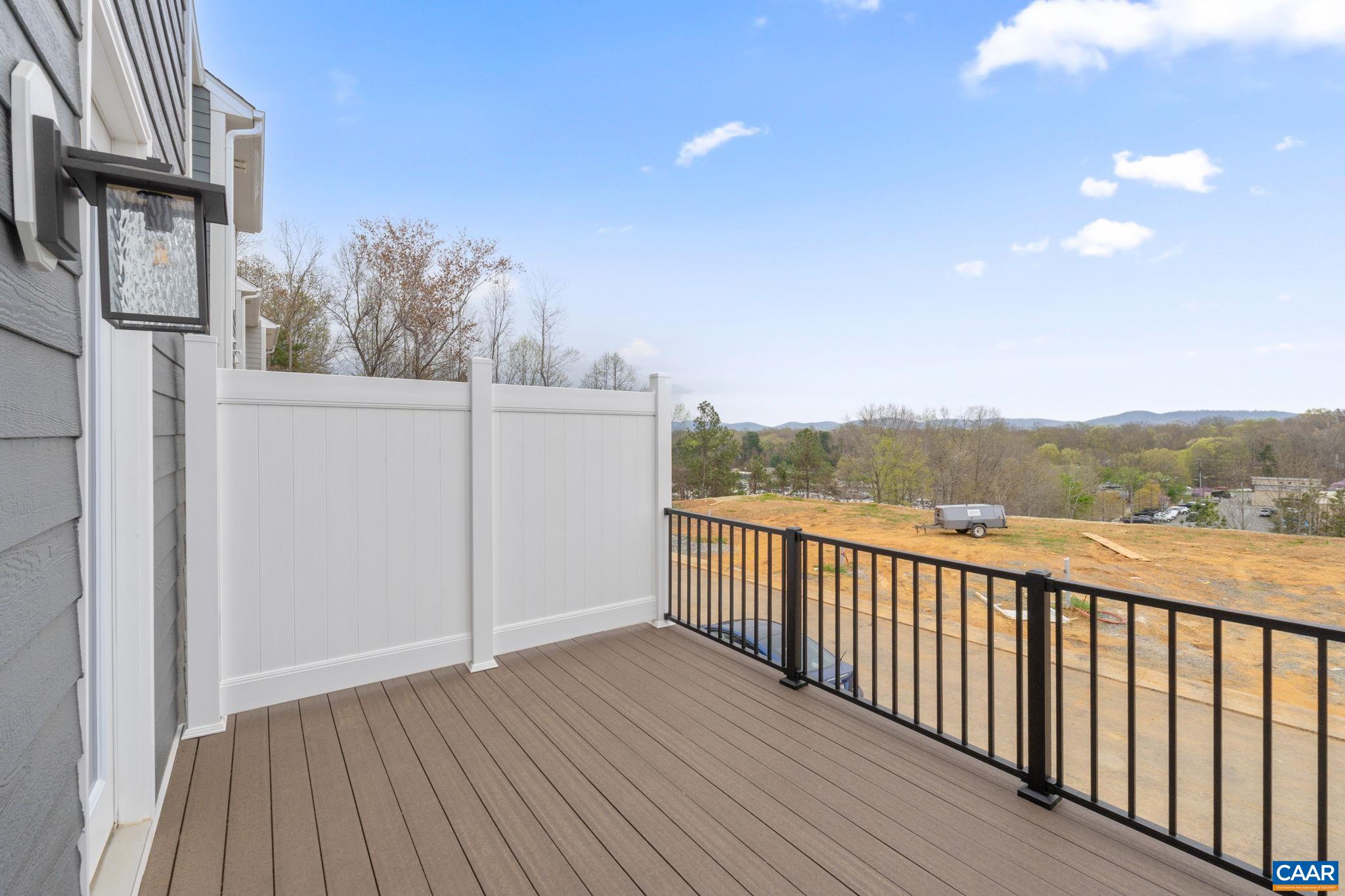 2249 Woodburn Road Charlottesville, VA 22901 - Photo 22 of 34 a view of a balcony with wooden floor