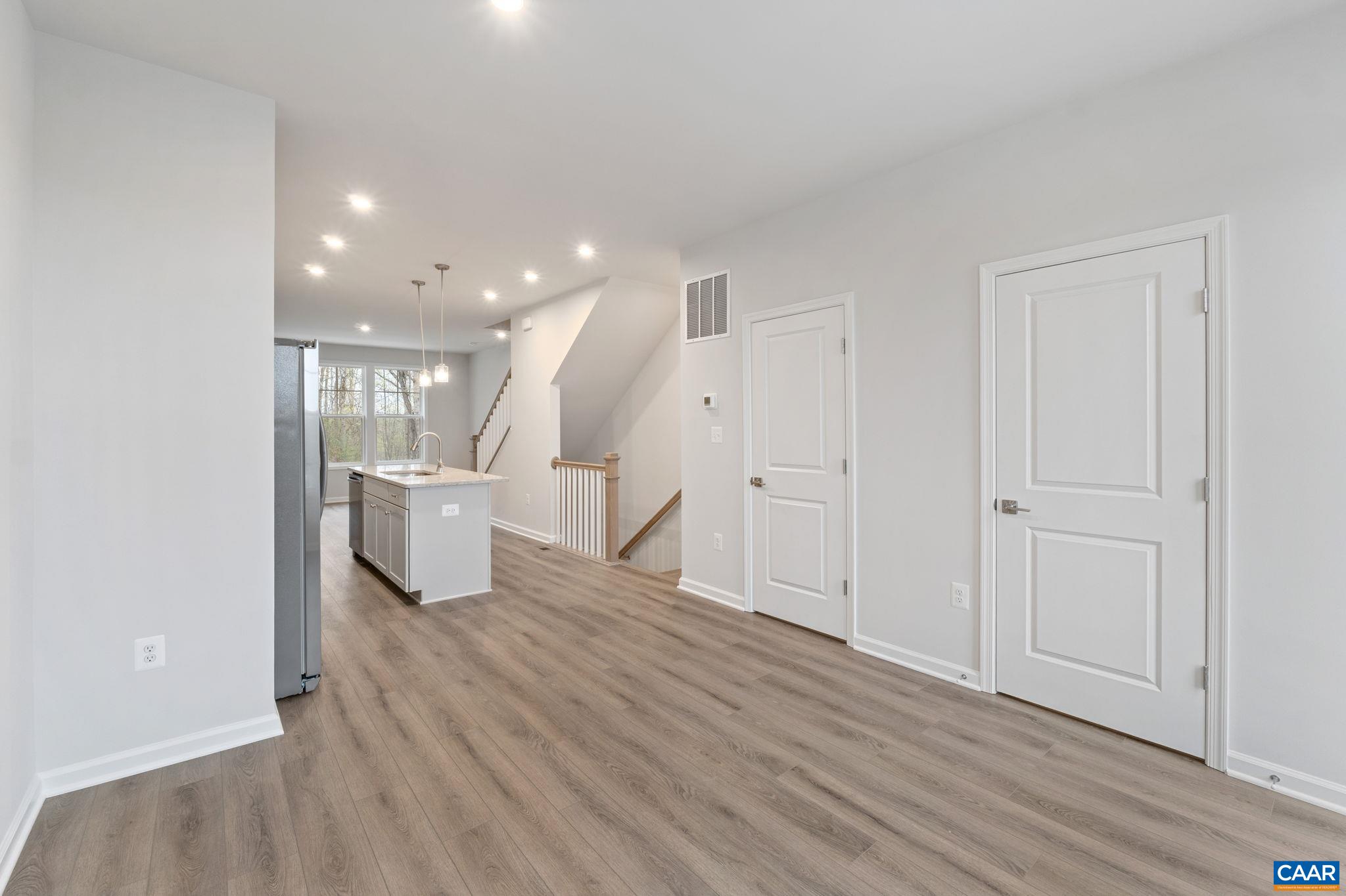 2249 Woodburn Road Charlottesville, VA 22901 - Photo 4 of 34 a living room with furniture and a wooden floor