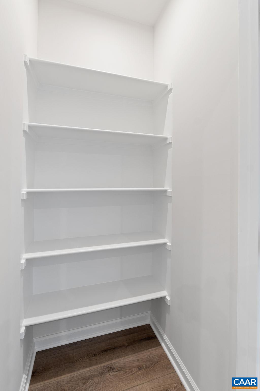 2249 Woodburn Road Charlottesville, VA 22901 - Photo 7 of 34 a view of walk in closet with empty racks