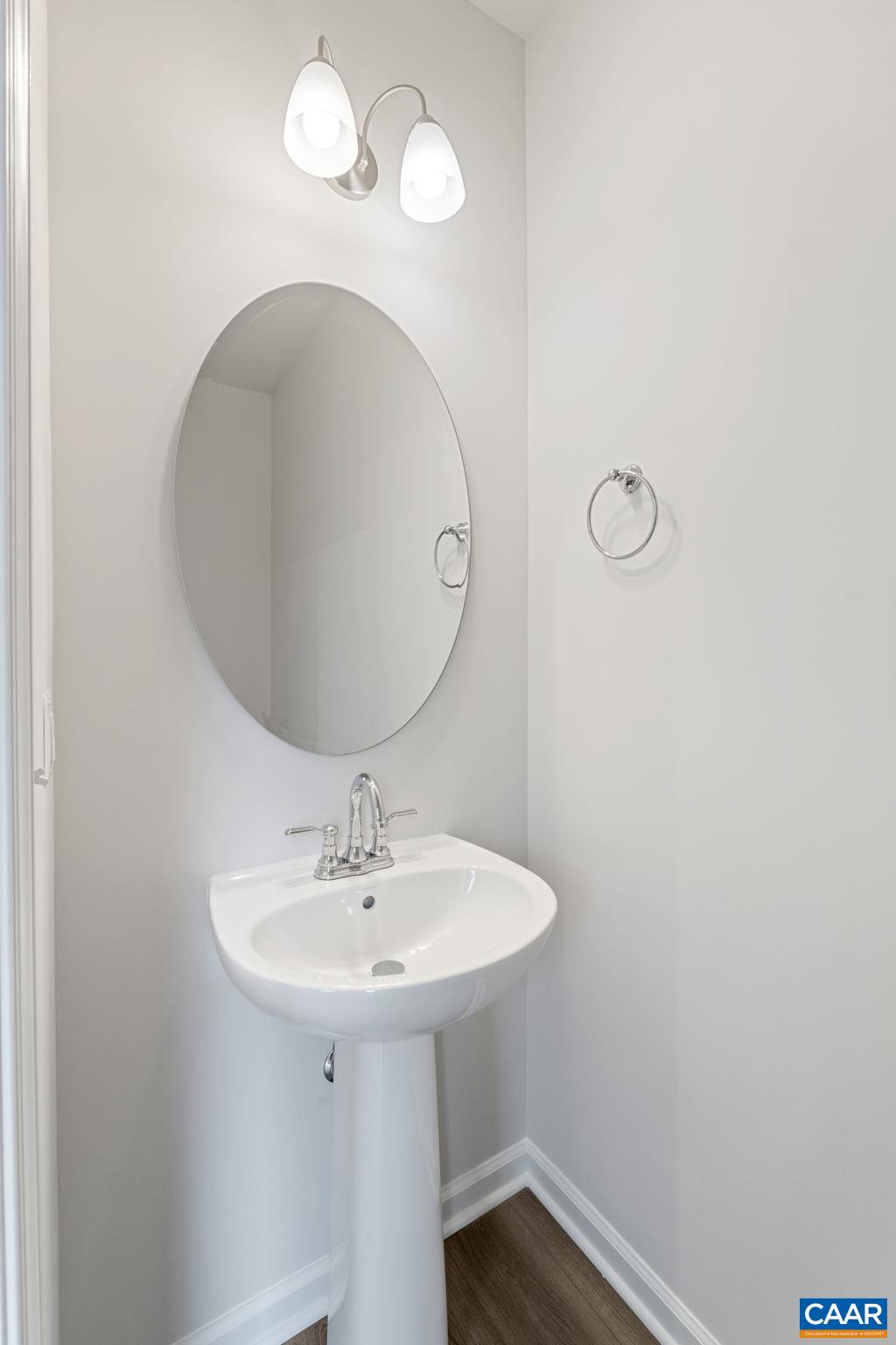 2249 Woodburn Road Charlottesville, VA 22901 - Photo 8 of 34 a bathroom with a sink a light fixture and a mirror