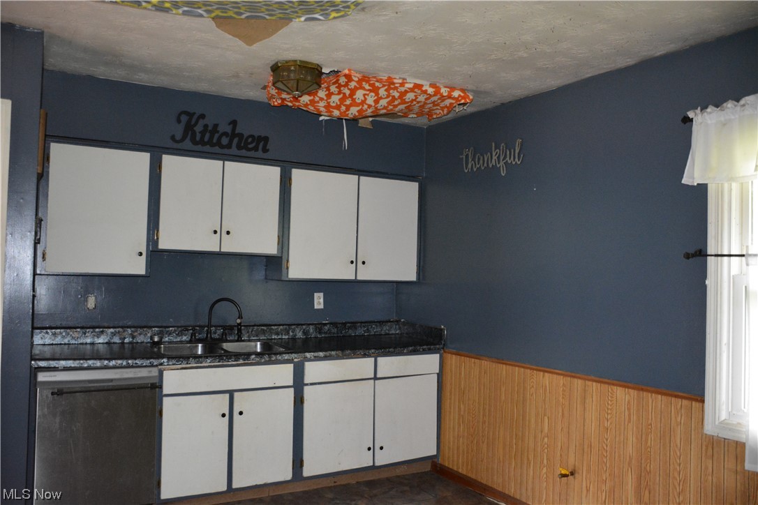 2791 Roberts Rdg Saint Joseph Road Moundsville, WV 26041 - Photo 12 of 24 Kitchen featuring sink, white cabinets, and dishwasher