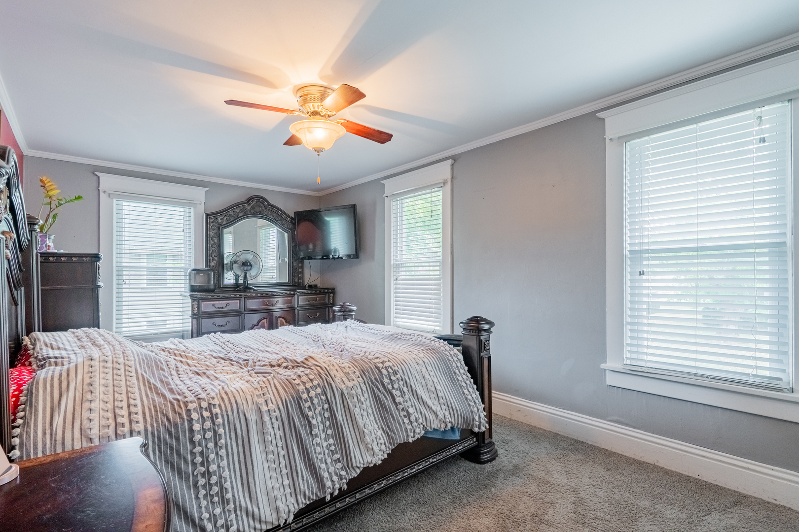 310 South Pleasant Street Princeton, IL 61356 - Photo 11 of 36 a bedroom with a large bed and a window