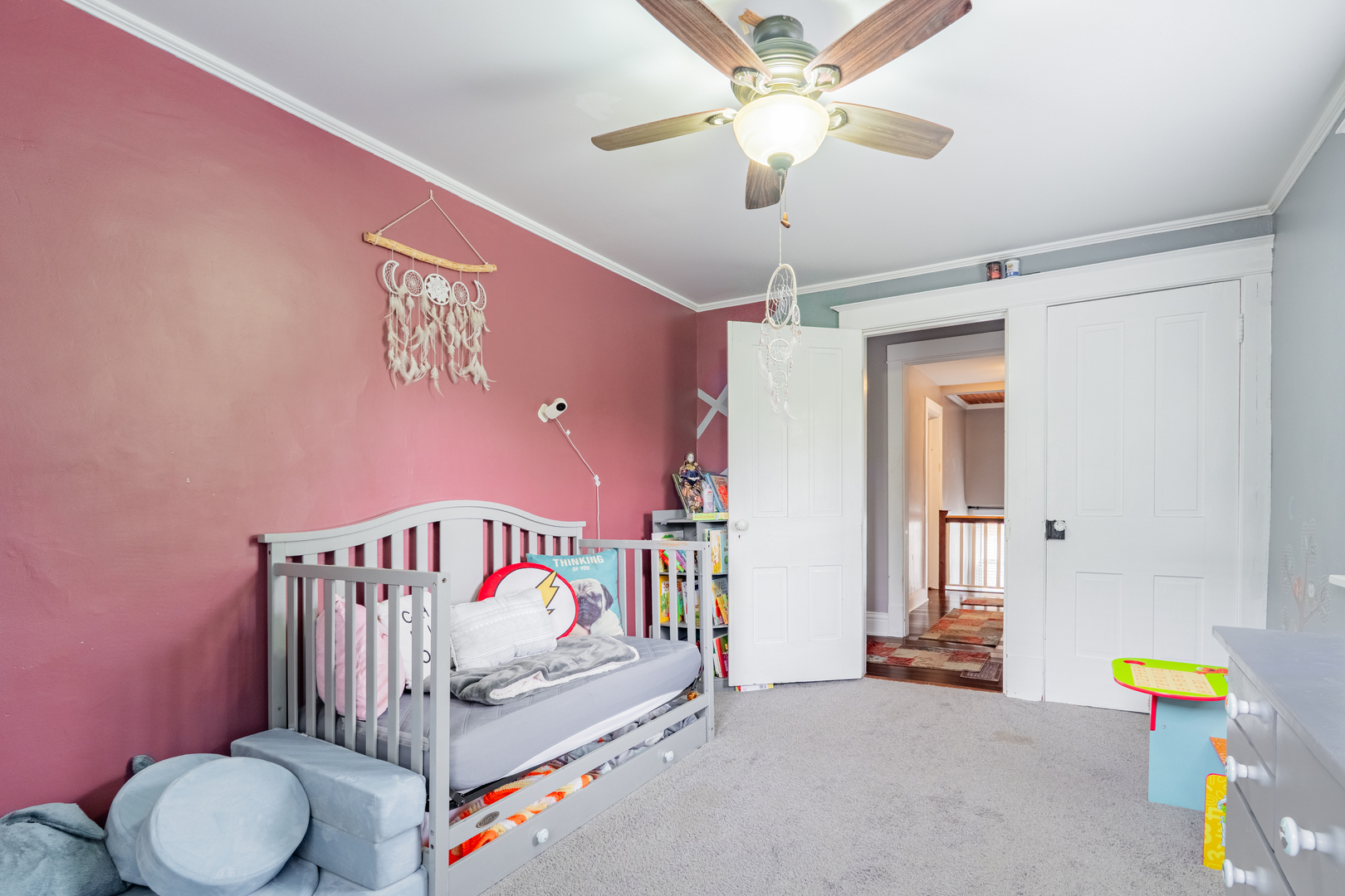 310 South Pleasant Street Princeton, IL 61356 - Photo 17 of 36 a bedroom with furniture and a chandelier fan