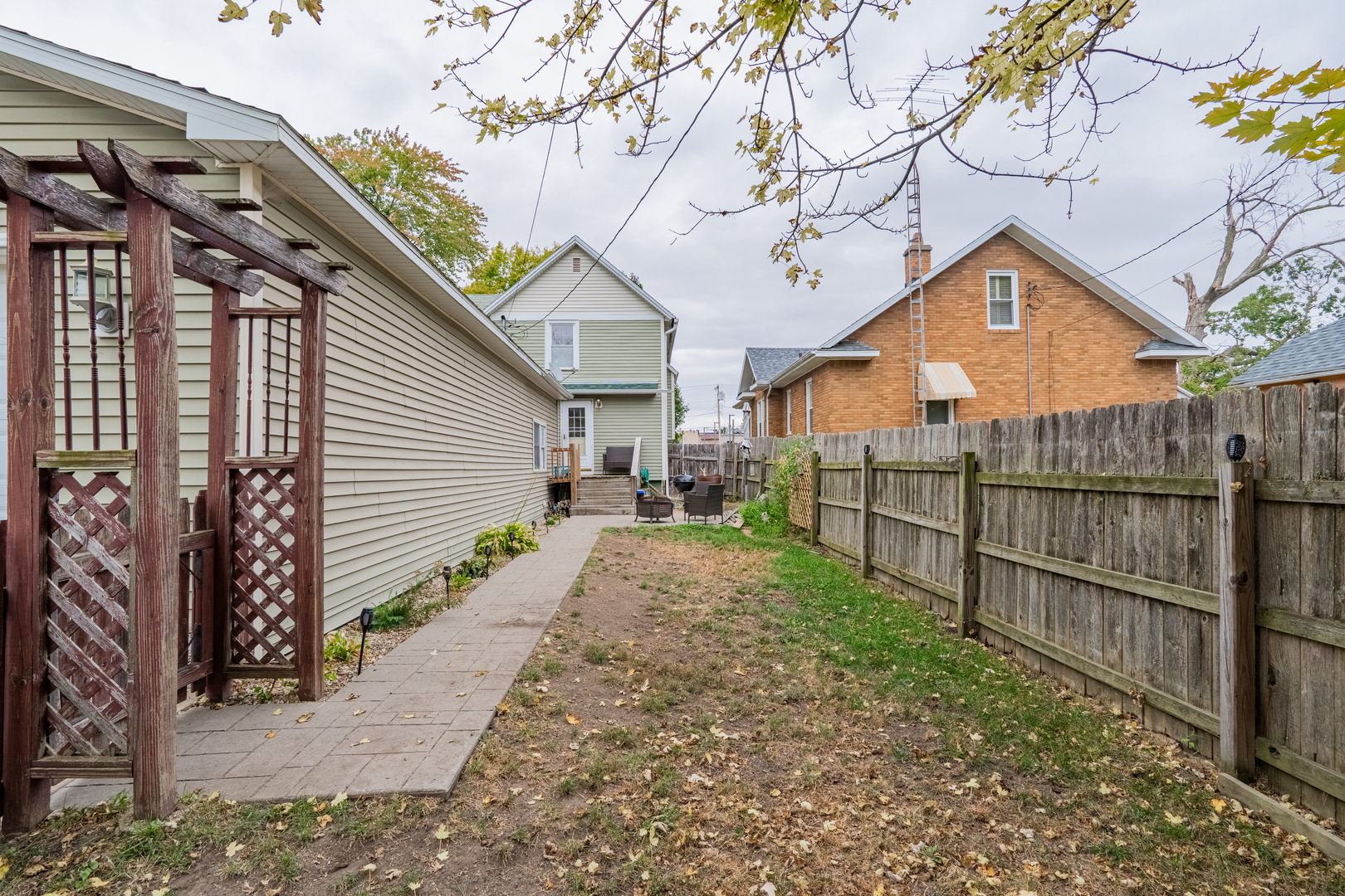 310 South Pleasant Street Princeton, IL 61356 - Photo 26 of 36 a view of a yard in front of a house with wooden fence