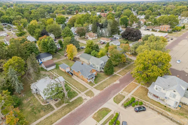an aerial view of residential houses with outdoor space