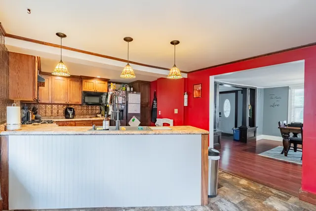 a view of a living room and kitchen