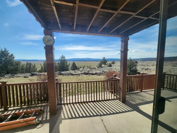 a view of a balcony with wooden floor