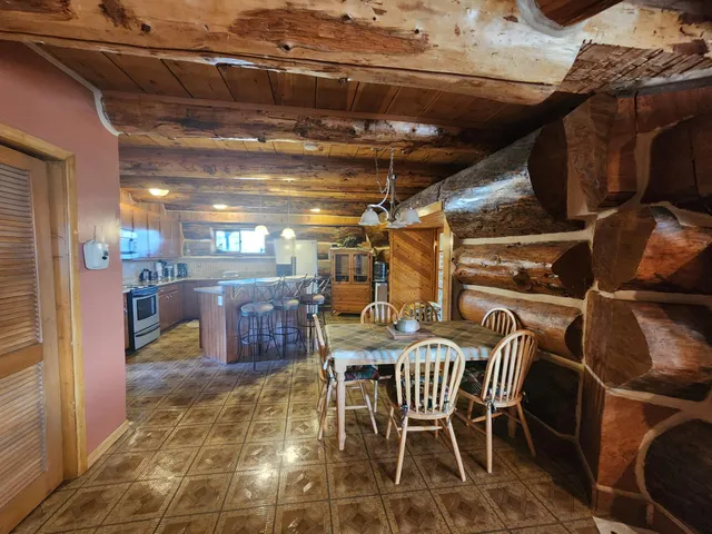 a view of a chairs and table in a room