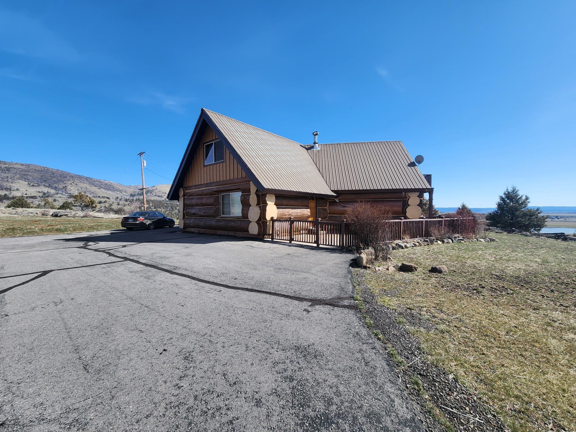 4455 County Road 90 Lookout, CA 96054 - Photo 30 of 43 a front view of a house with a yard and garage