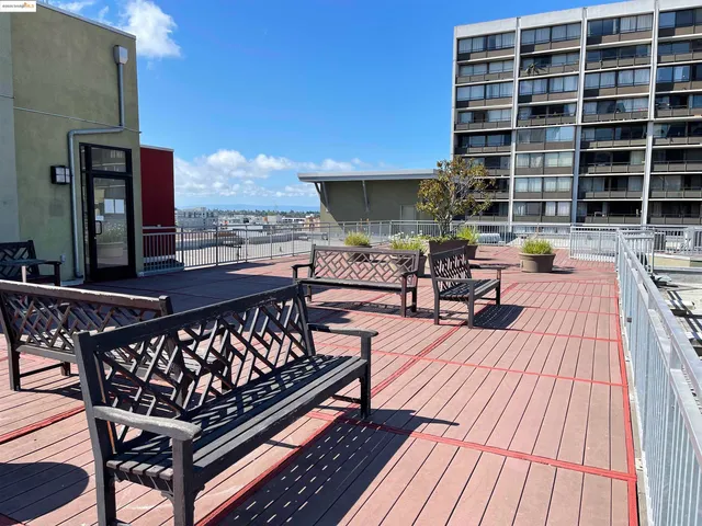 a roof deck view with a seating space