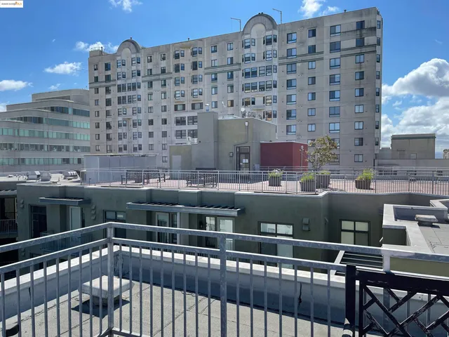 a view of a balcony with a city view