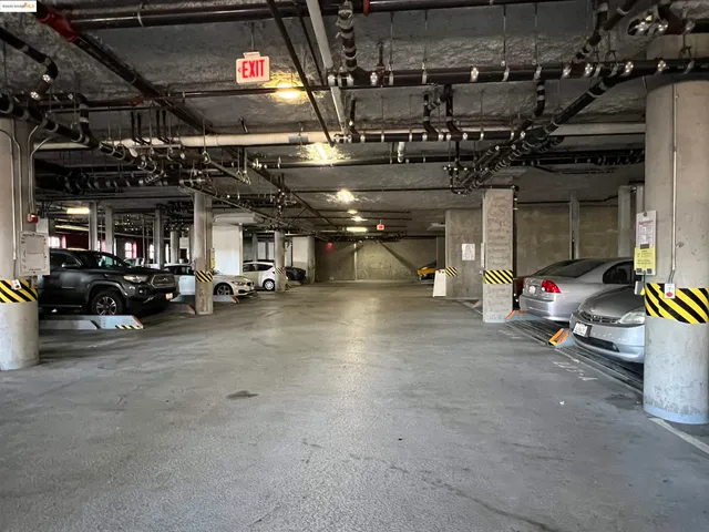 a view of a garage with cars