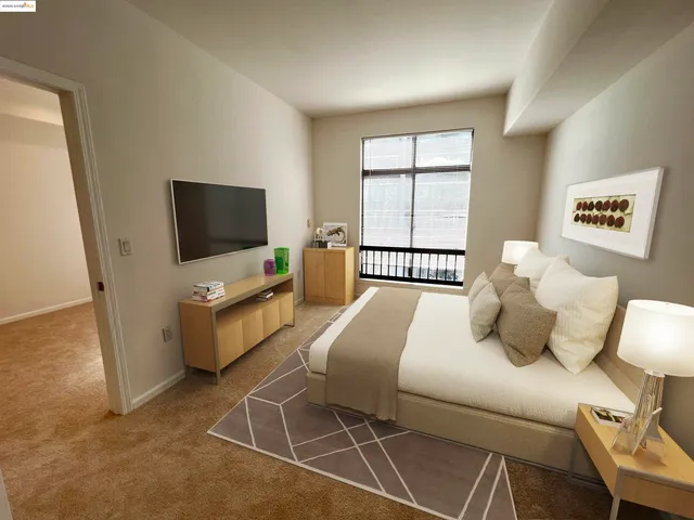 a bedroom with a bed and tv