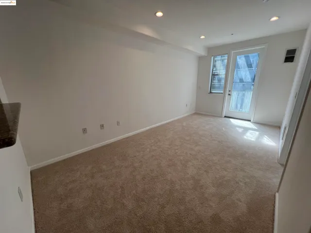 a view of an empty room with a fireplace
