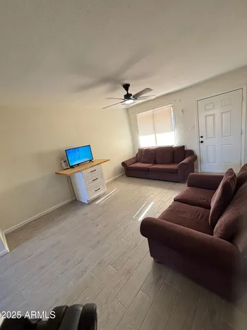 a living room with furniture and a window