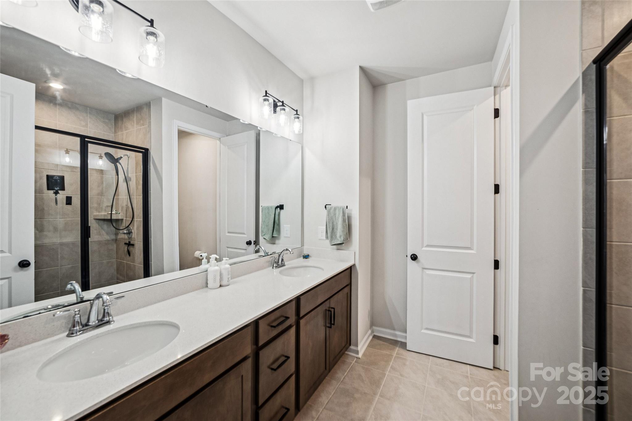 1103 Grays Ml Road Charlotte, NC 28215 - Photo 14 of 25 a bathroom with a double vanity sink mirror and double