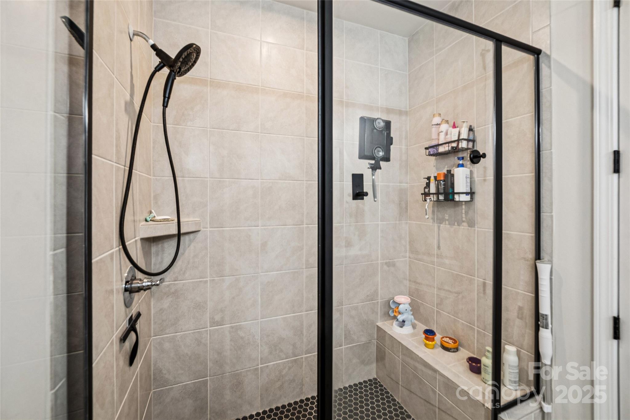 1103 Grays Ml Road Charlotte, NC 28215 - Photo 15 of 25 a bathroom with a glass shower door