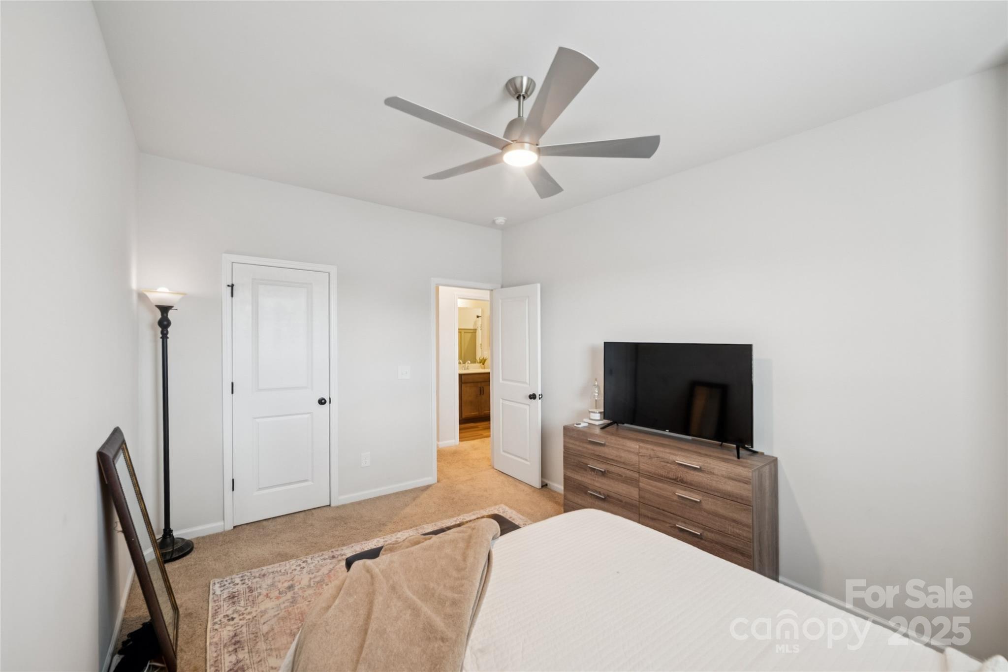 1103 Grays Ml Road Charlotte, NC 28215 - Photo 18 of 25 a bedroom with a bed and a flat screen tv