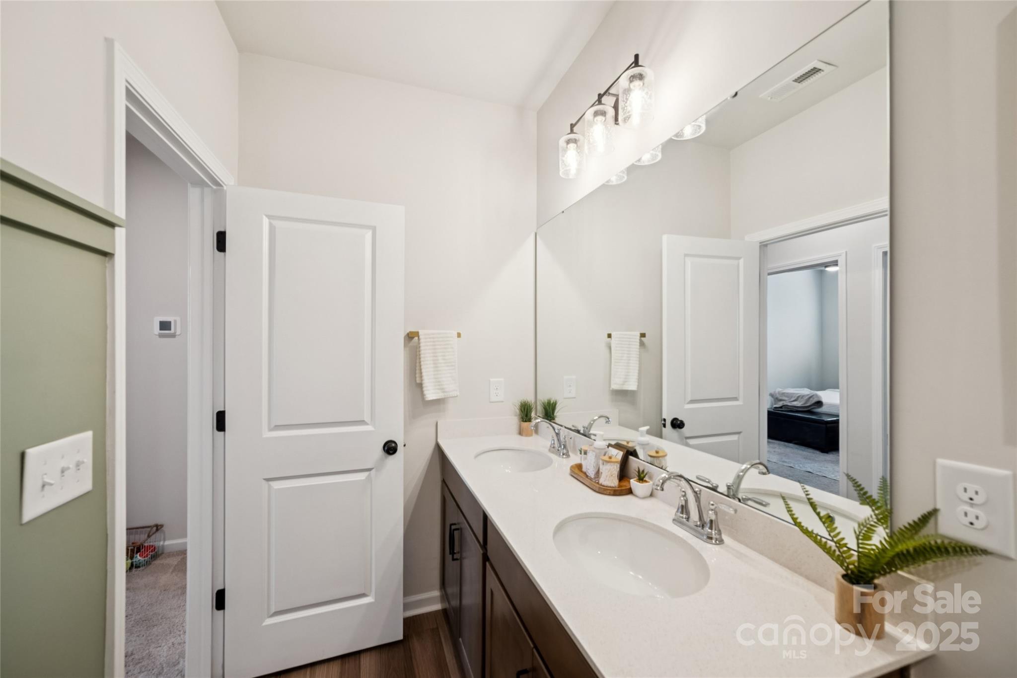1103 Grays Ml Road Charlotte, NC 28215 - Photo 20 of 25 a bathroom with a sink double vanity and a mirror