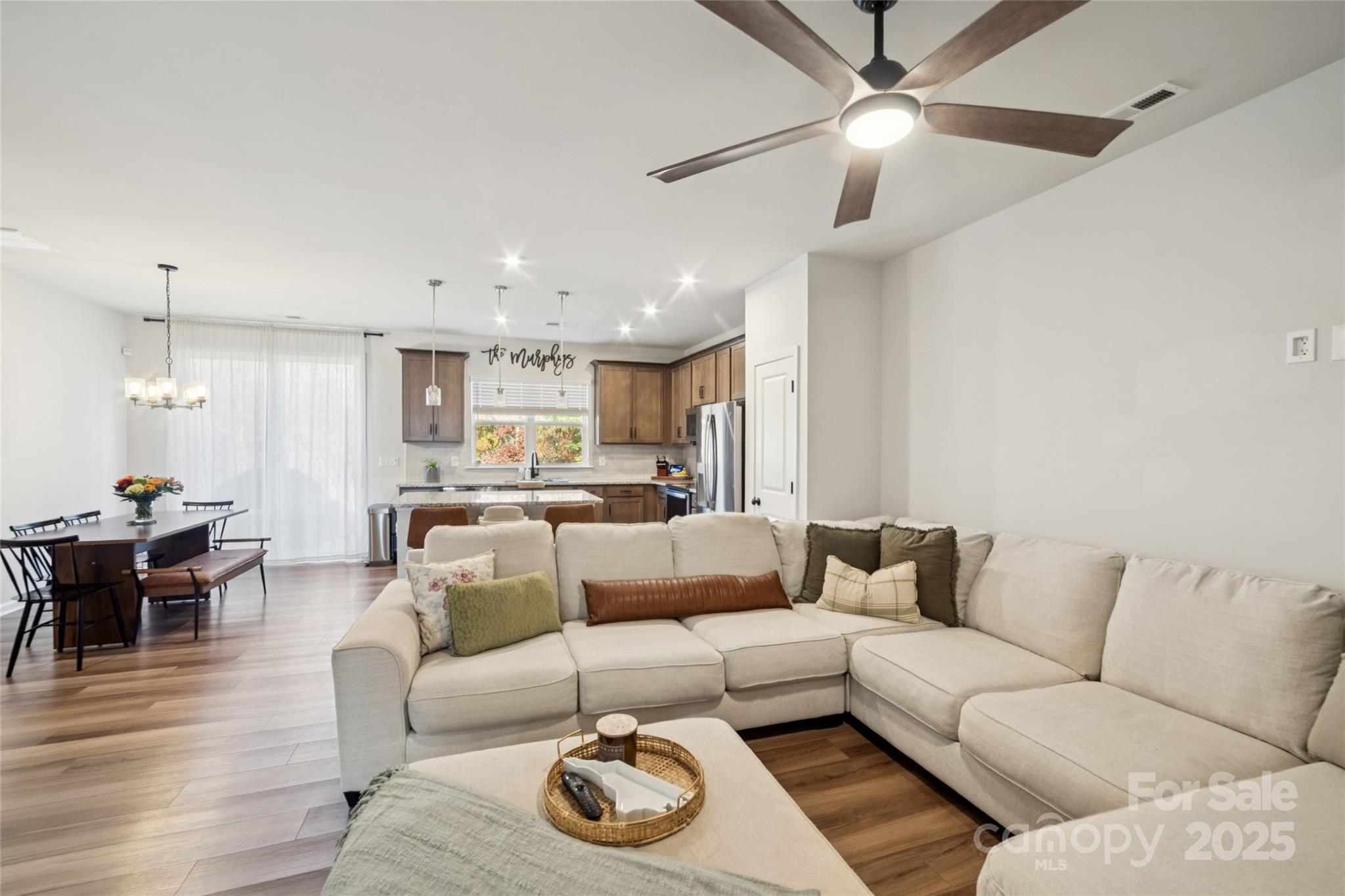 1103 Grays Ml Road Charlotte, NC 28215 - Photo 5 of 25 a living room with furniture and a wooden floor
