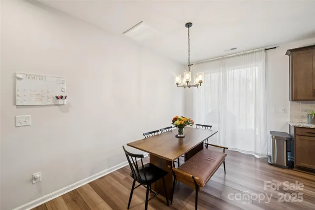 a kitchen with stainless steel appliances granite countertop a stove refrigerator sink and cabinets