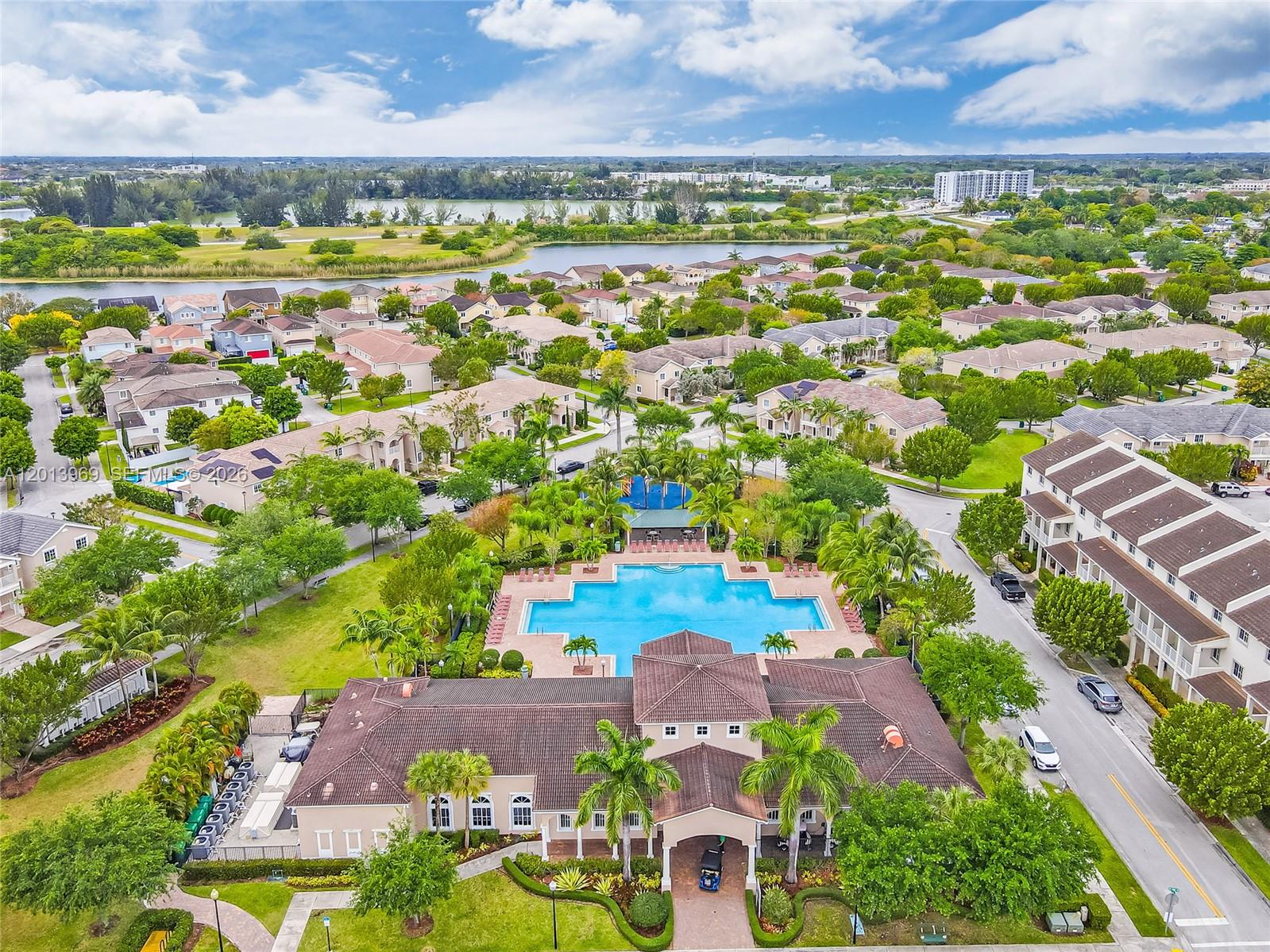 14044 Southwest 273rd Lane, Unit 14044 Homestead, FL 33032 - Photo 41 of 44 an aerial view of residential houses with outdoor space and street view