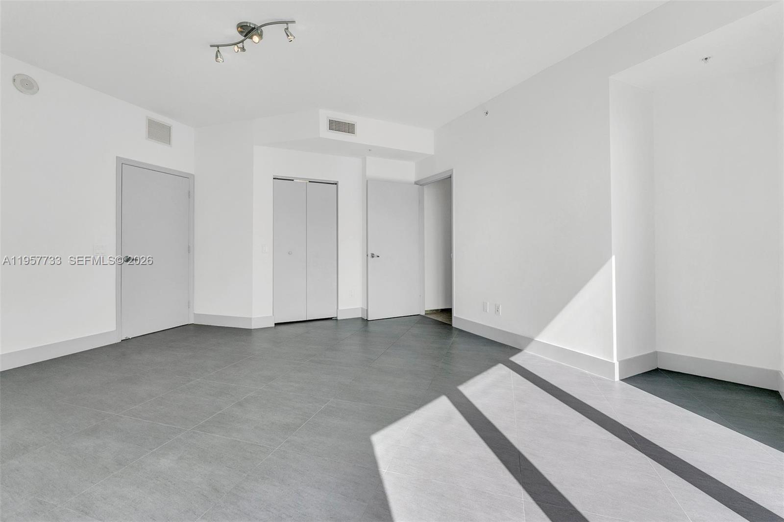 60 Southwest 13th Street, Unit 3400 Miami, FL 33130 - Photo 21 of 50 a view of an empty room with closet