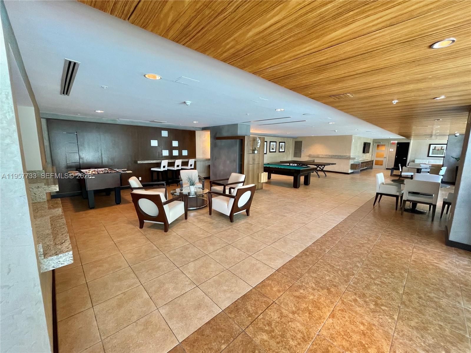 60 Southwest 13th Street, Unit 3400 Miami, FL 33130 - Photo 39 of 50 a living room with furniture a dining table and kitchen view