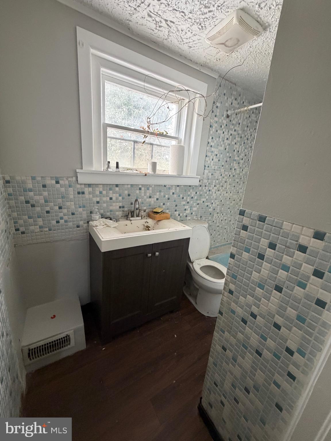 824 South 8th Street Camden, NJ 08103 - Photo 9 of 11 a bathroom with a sink toilet and window