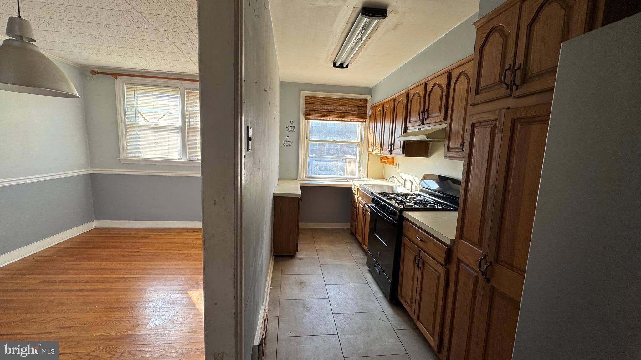 2922 Fanshawe Street Philadelphia, PA 19149 - Photo 6 of 21 a kitchen with stainless steel appliances granite countertop a stove and a refrigerator