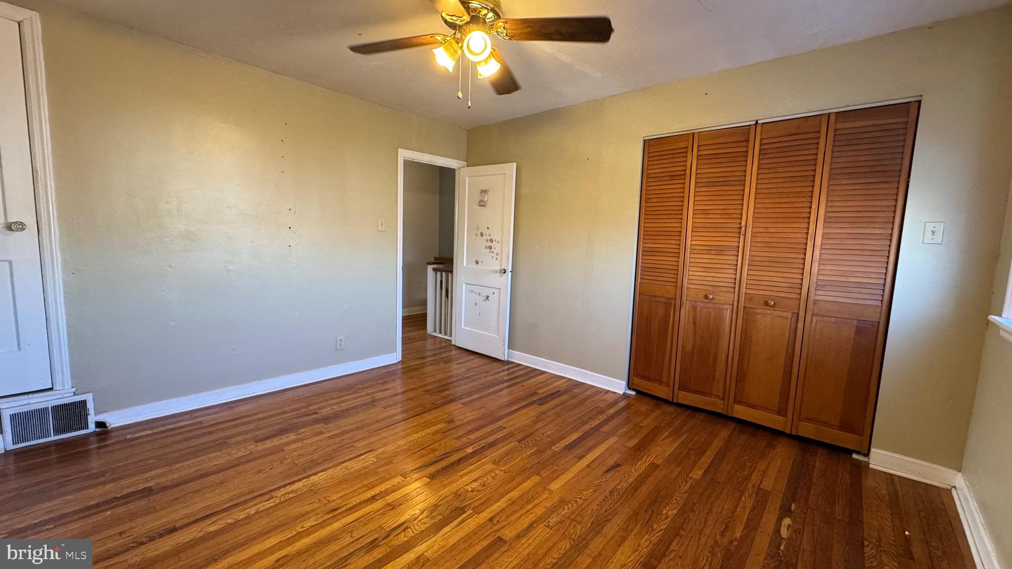 2922 Fanshawe Street Philadelphia, PA 19149 - Photo 10 of 21 an empty room with wooden floor and windows