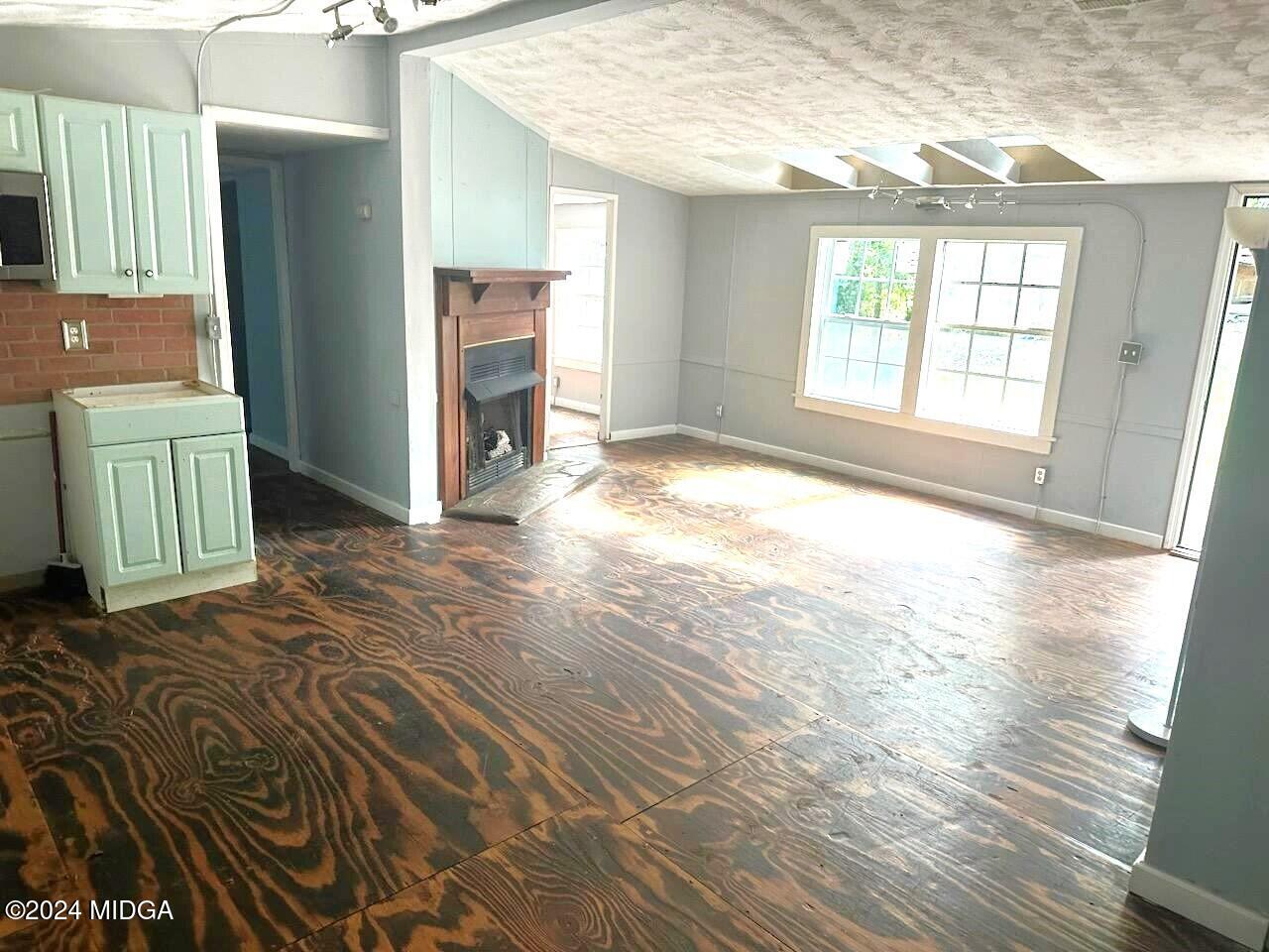 3091 Tribble Road Fort Valley, GA 31030 - Photo 3 of 7 a view of an empty room with a window