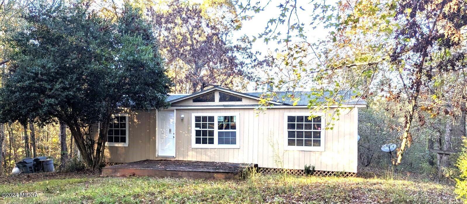 3091 Tribble Road Fort Valley, GA 31030 - Photo 6 of 7 front view of a house with a yard