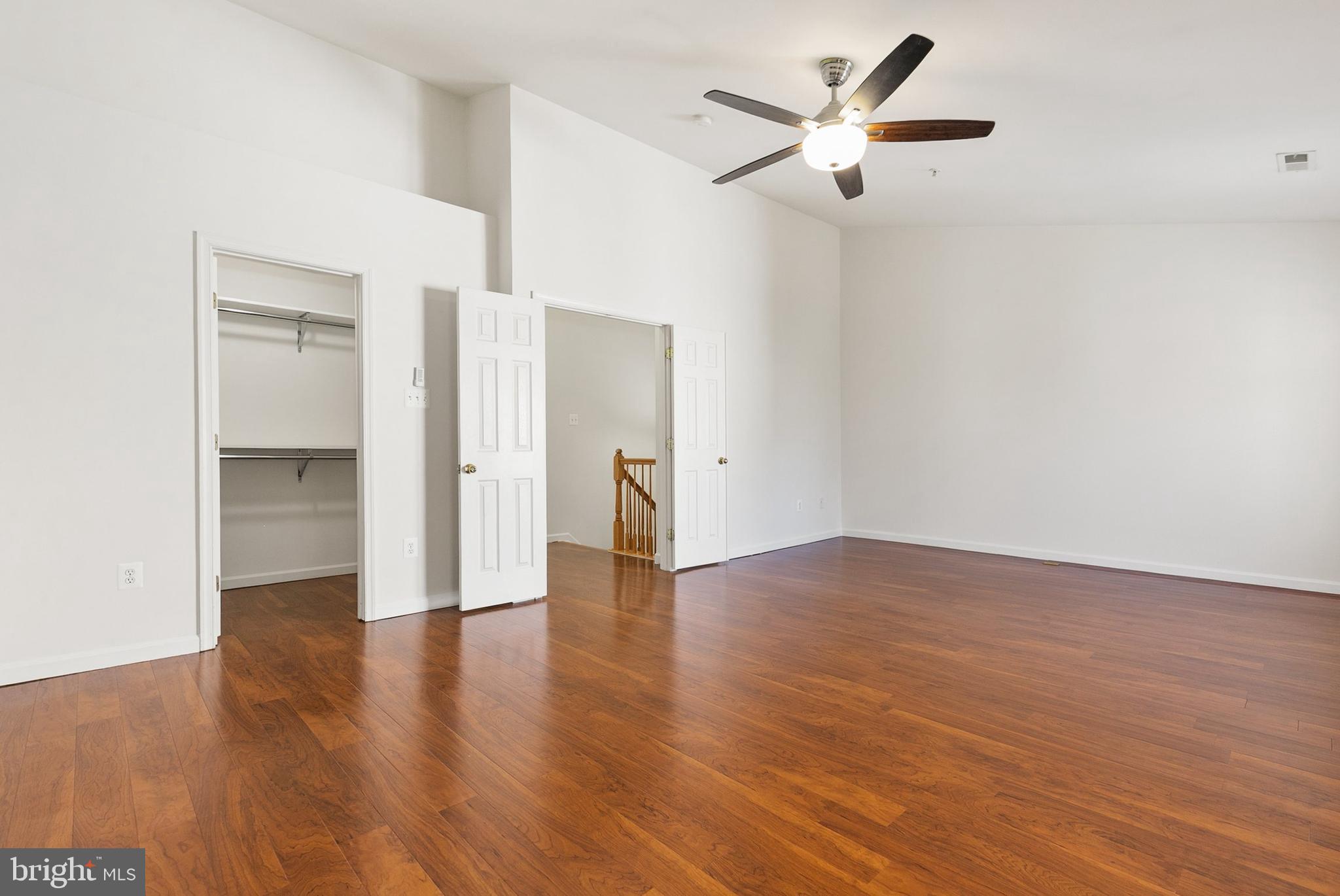 9956 Fragrant Lilies Way Laurel, MD 20723 - Photo 31 of 60 an empty room with wooden floor and a ceiling fan