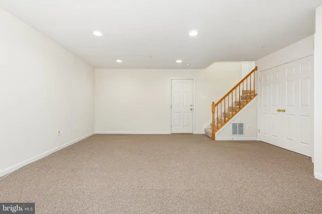 a view of a porch with wooden floor and floor to ceiling window