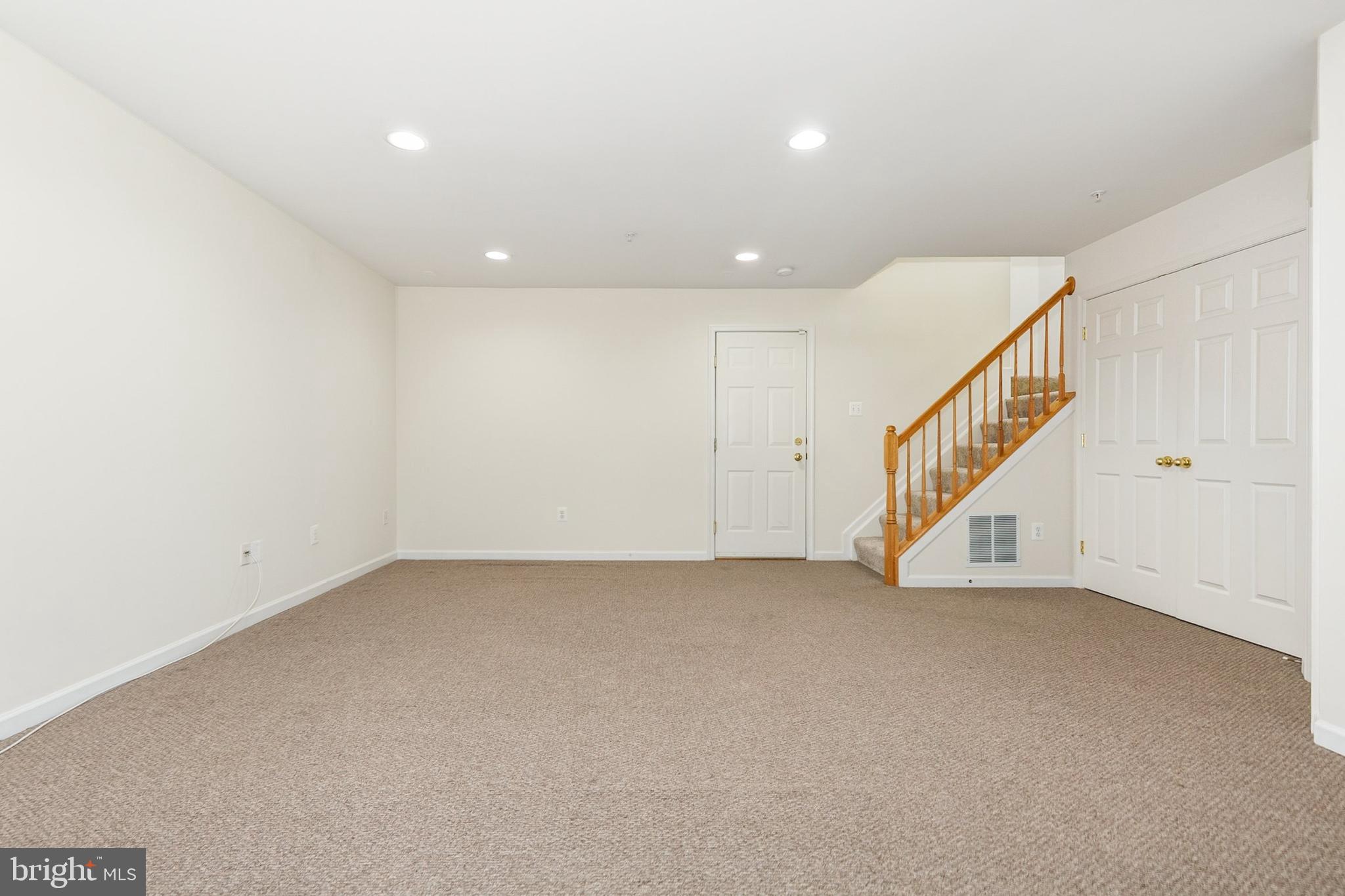 9956 Fragrant Lilies Way Laurel, MD 20723 - Photo 42 of 60 a view of an empty room with stairs