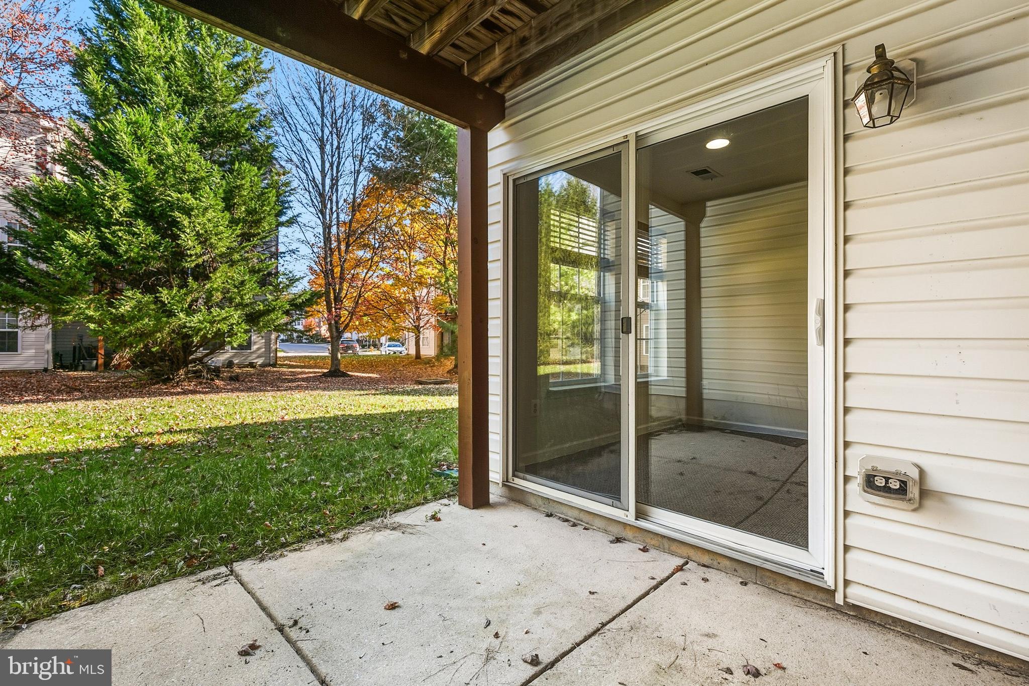 9956 Fragrant Lilies Way Laurel, MD 20723 - Photo 53 of 60 a view of a porch with a backyard
