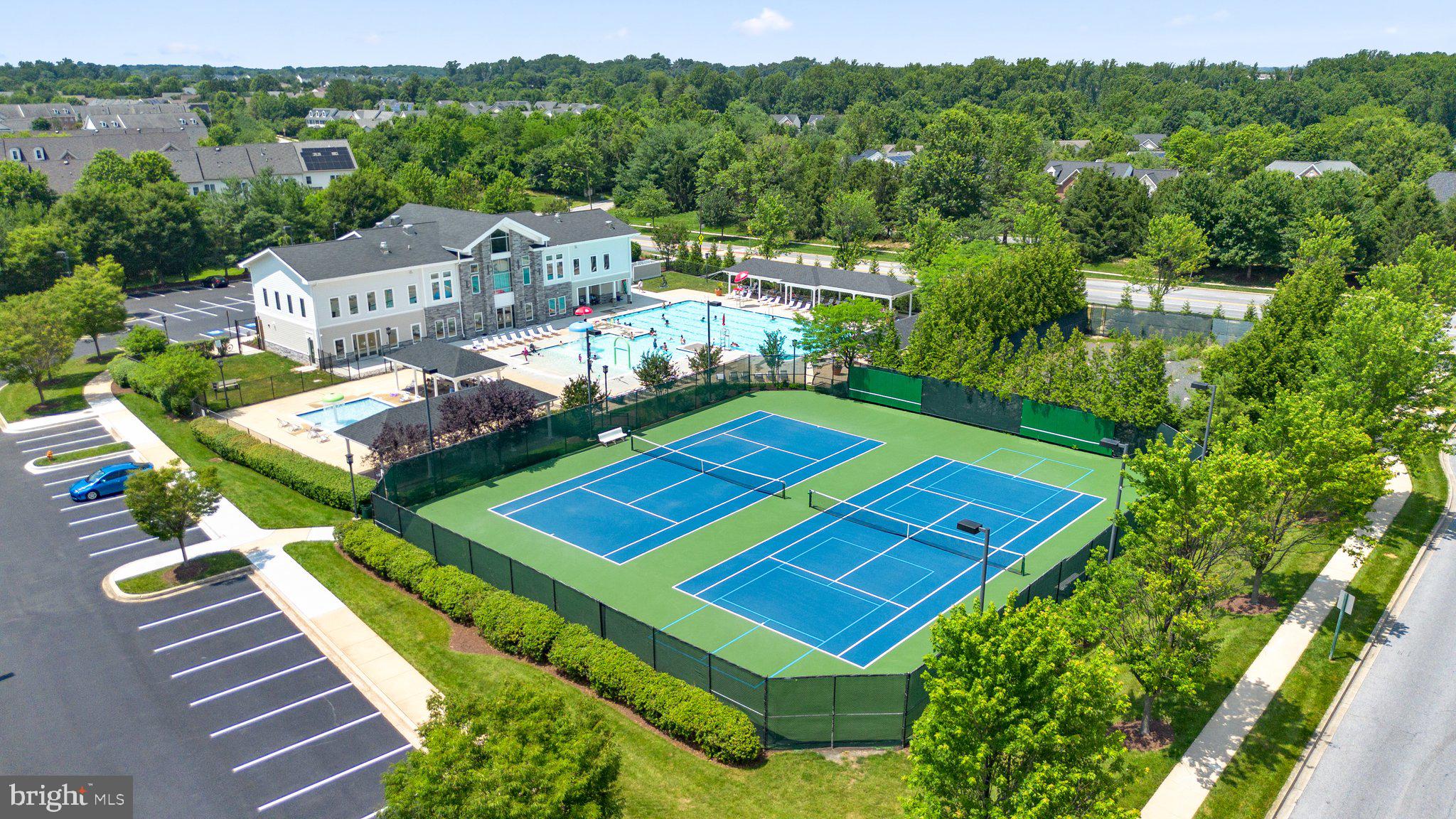 9956 Fragrant Lilies Way Laurel, MD 20723 - Photo 57 of 60 a view of a tennis ground with large trees