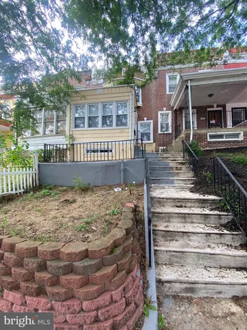 a front view of house with a yard