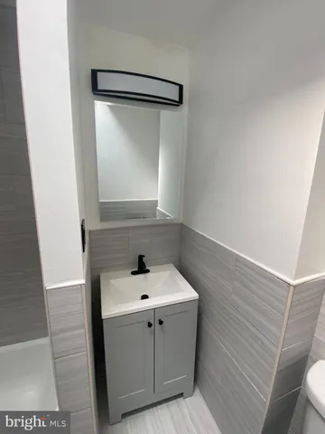 a bathroom with a sink and mirror