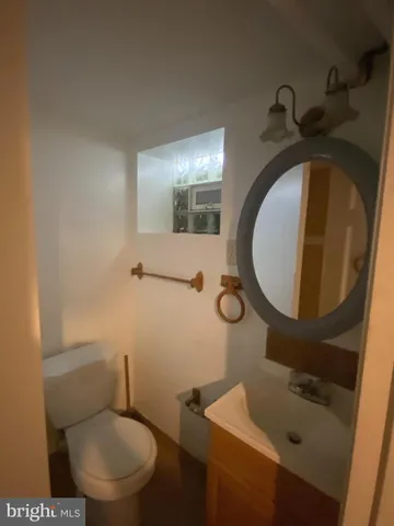a bathroom with a shower and toilet